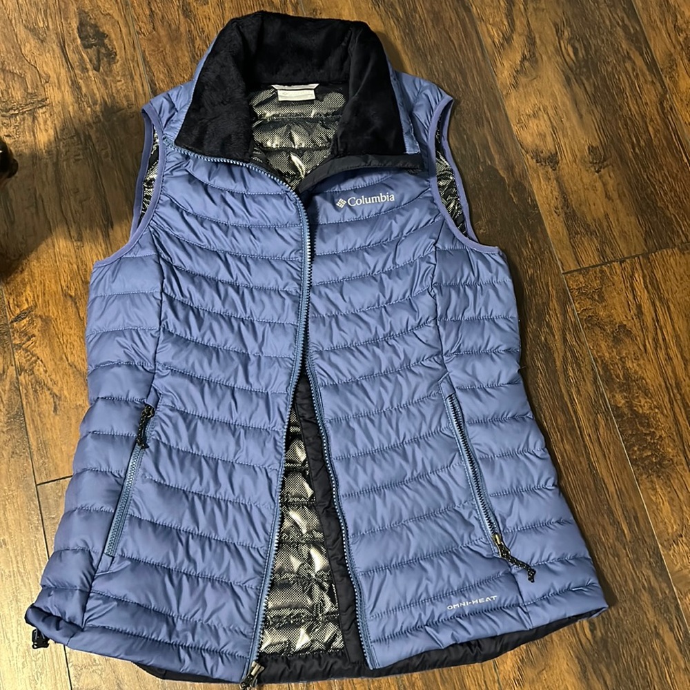 Columbia waist length blue vest with lining , polyester material size medium